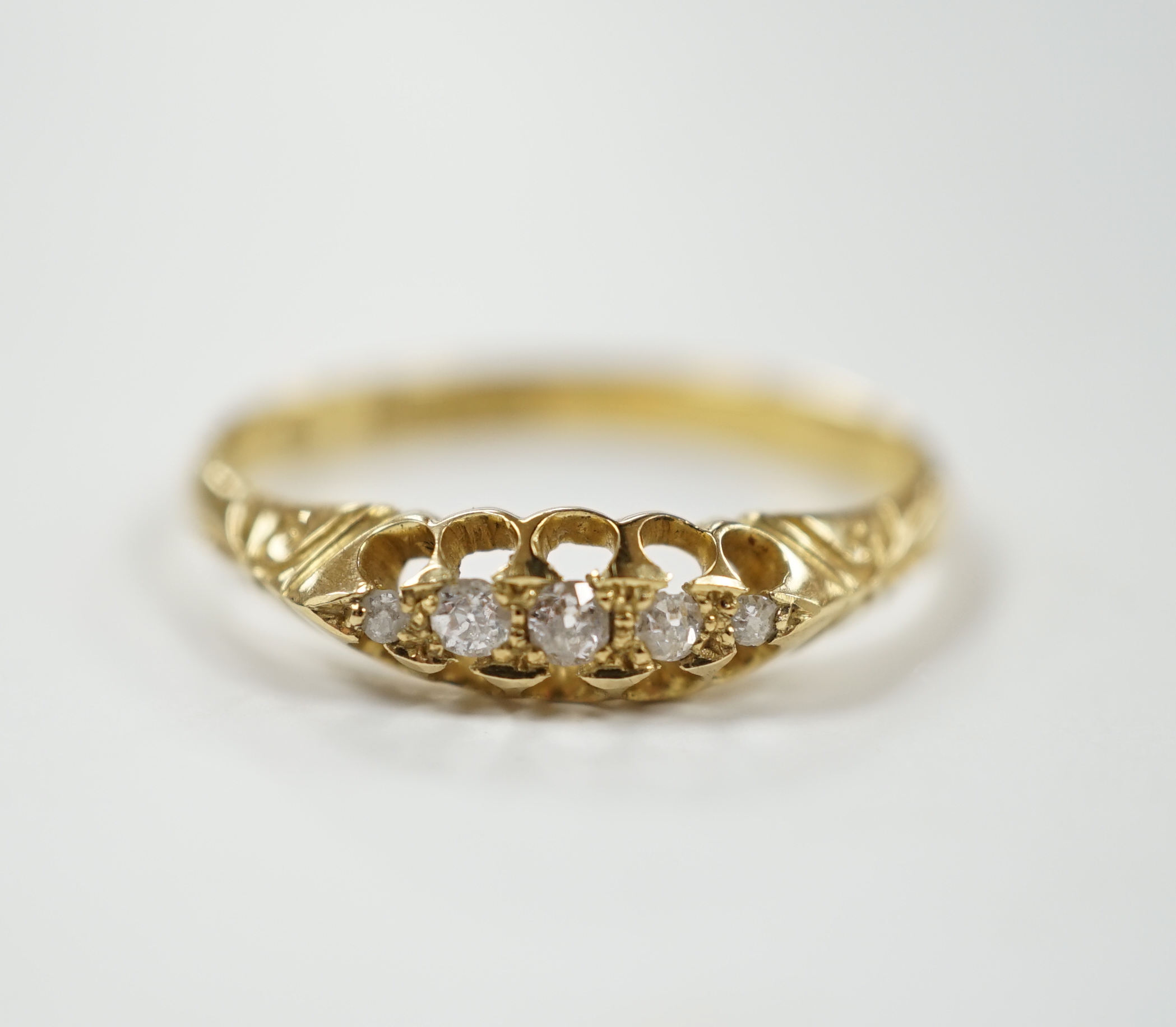 A Victorian 18ct gold and graduated five stone diamond chip set half hoop ring, size X, gross weight 3.6 grams.